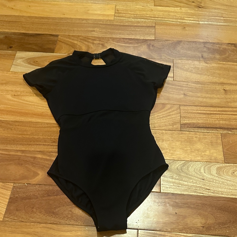 Nikolay AXS mesh short sleeve cap leotard, mesh detail at waist. Excellent cond